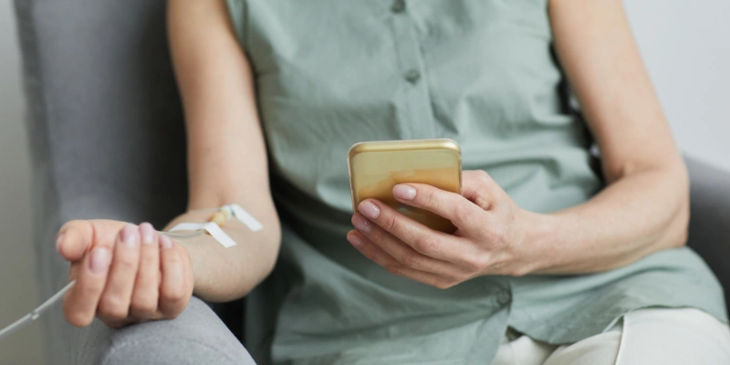 Woman relaxing with an IV drip.