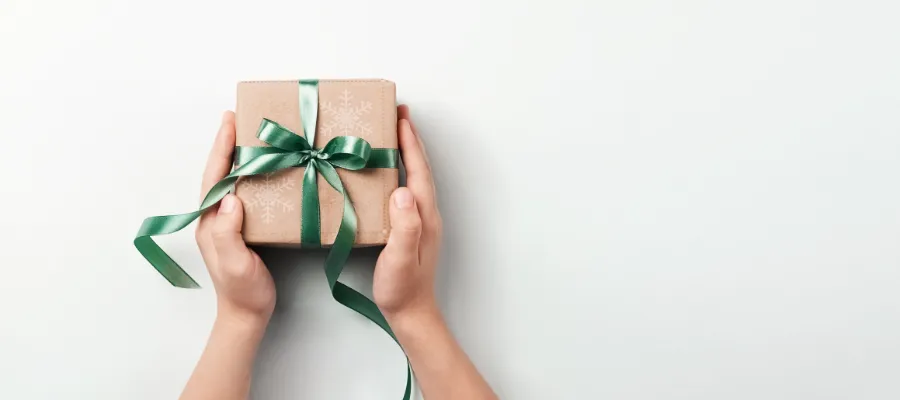 Person holding a gift box.